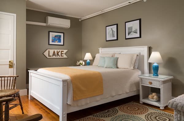 The queen bed and nightstands in the bedroom