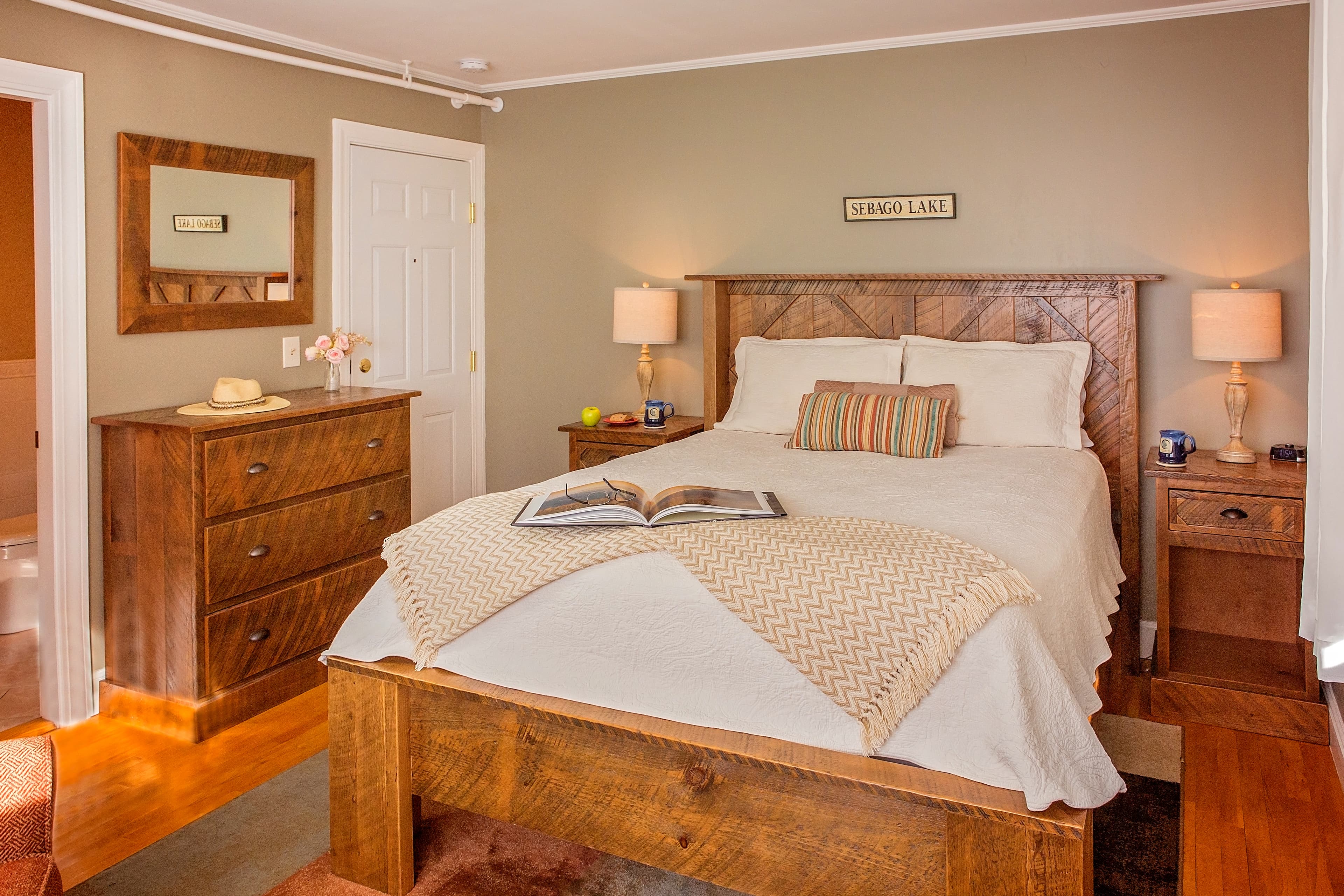 The custom made barnboard queen bed, nightstands, dresser and mirror.