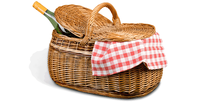 A woven picnic basket with a red and white checkered cloth and a bottle of wine peeking out. A woven picnic basket with a red and white checkered cloth and a bottle of wine peeking out.