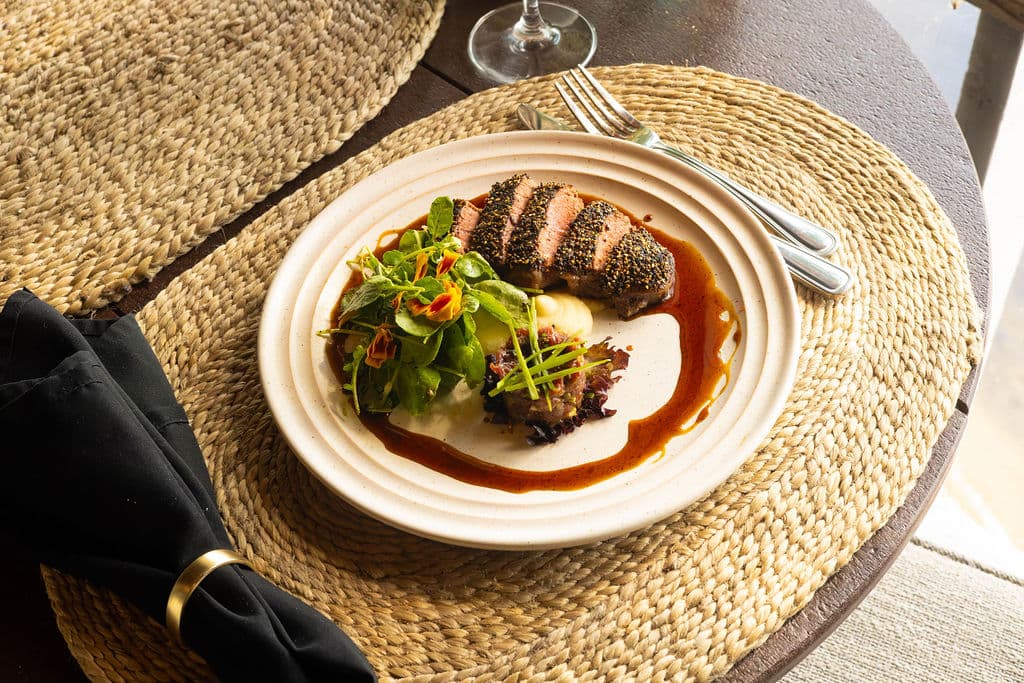 A plated elevated steak dish