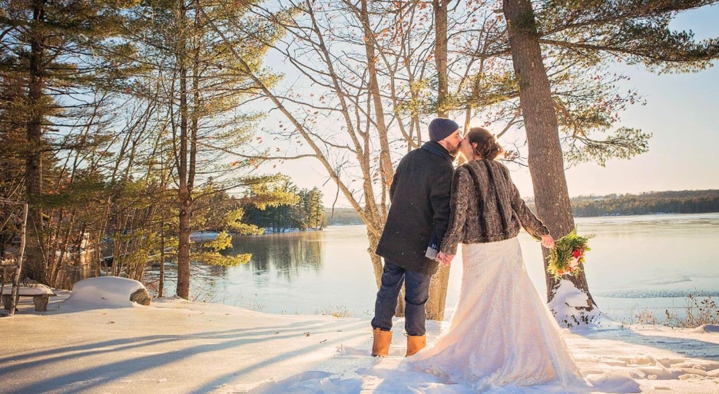 bride and groom kissing at wolf cove inn wedding