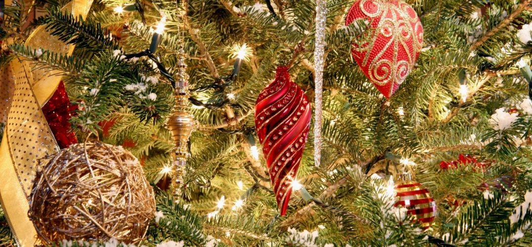Sparkling Christmas tree with twinkling white lights and red and gold decorations