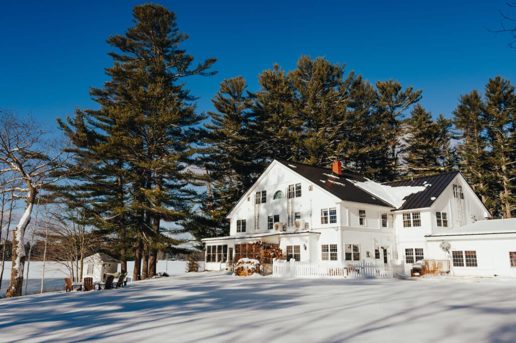 The lawn view of a wintery wolf cove inn